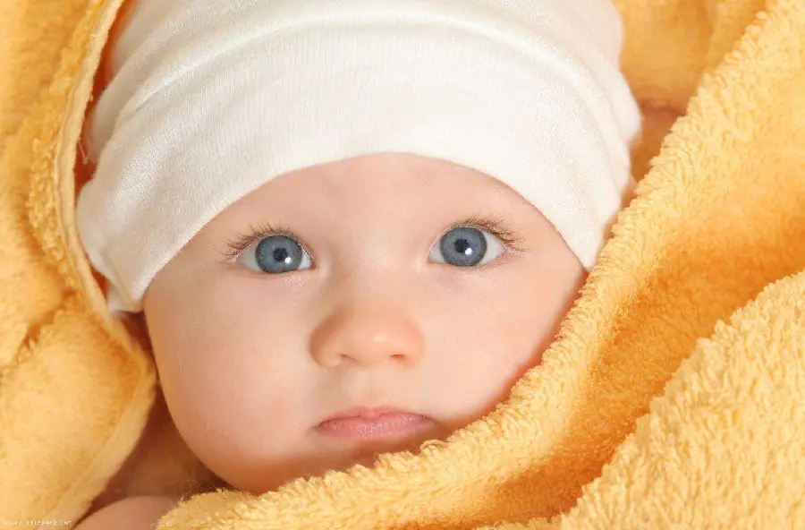 Interesting photo of a cute baby in a blanket in 4k quality for background
