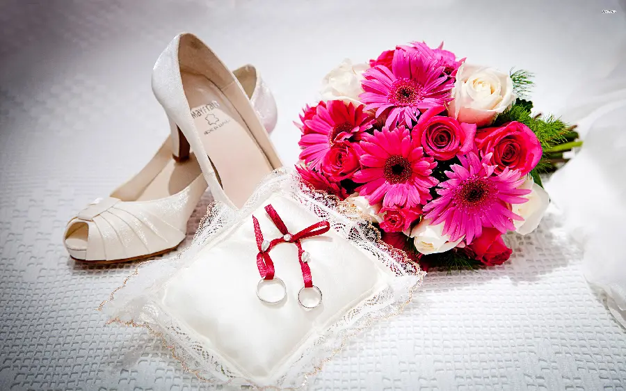 New wallpaper of a wedding ring next to a beautiful flower and shoe 