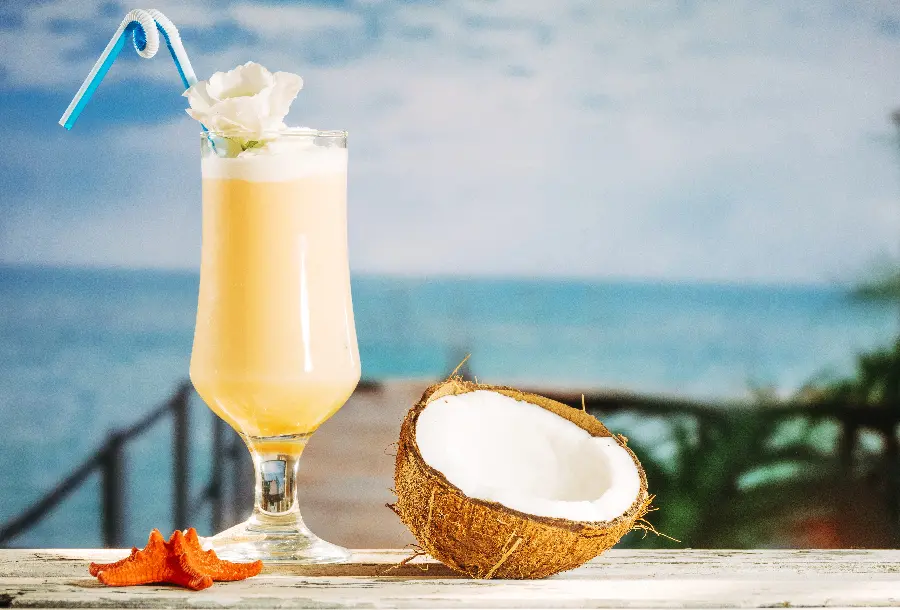 Relaxing image of a delicious and cool coconut drink on the beach