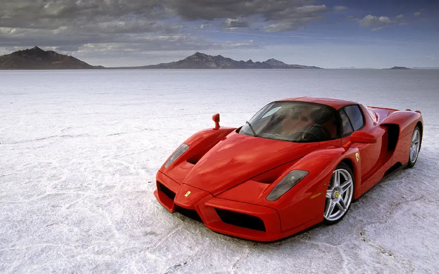 Energetic Ferrari Enzo image on a dry desert road for social networks