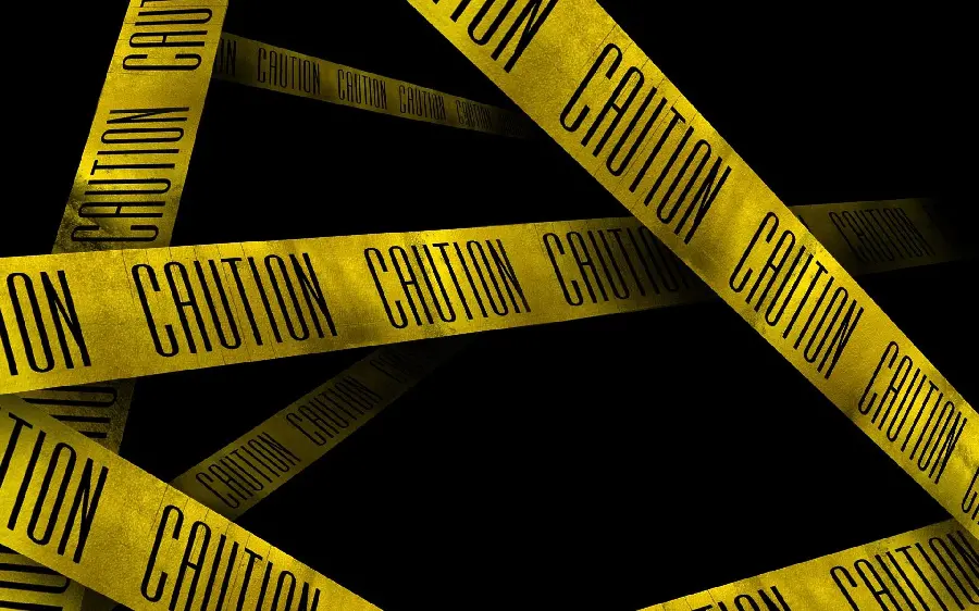 Dark background of yellow caution tape with 8k quality for mobile 