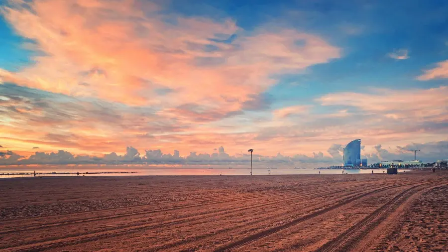 Download photo of the beach with many clouds for tourists in Barcelona in high quality