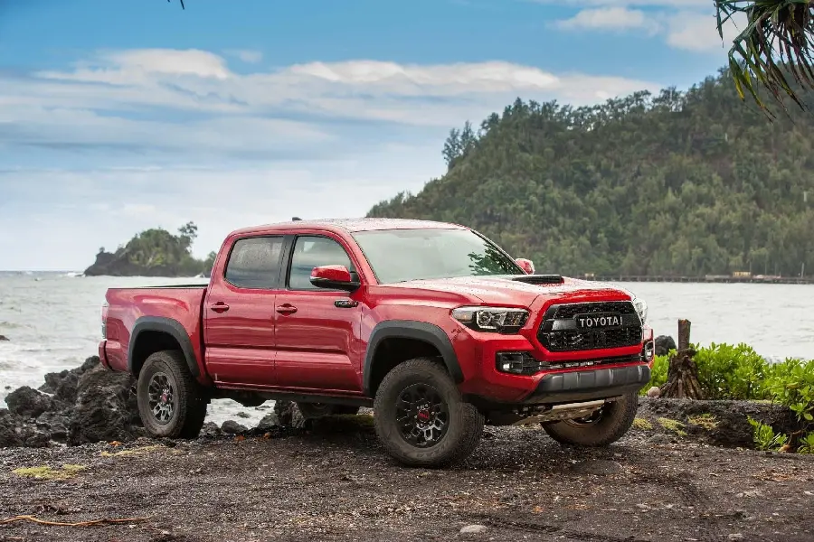 Awesome Stock Photo of a Red Toyota Tacoma on the Beach