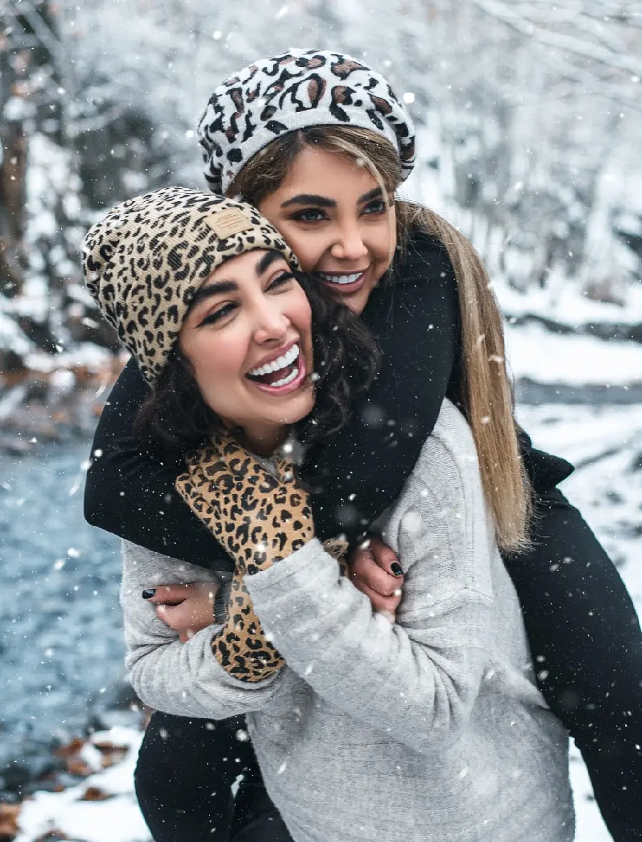 Friendly view of two cheerful girls with beautiful smiles for making a clip