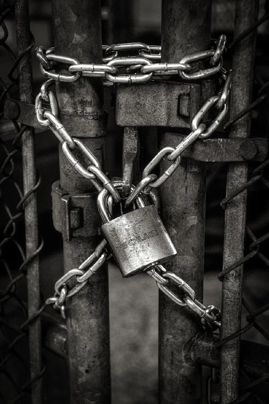 Black and white image of a lock and chain to make a caption photo 