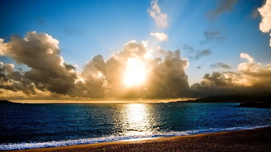 High quality enchanted stock photo From the nature of the wavy sea and the photo of the sun's view between the clouds