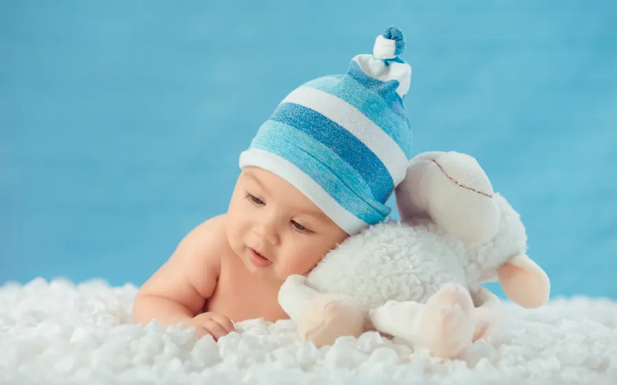 Lovely and new background of a little baby with a white and blue theme for a laptop 