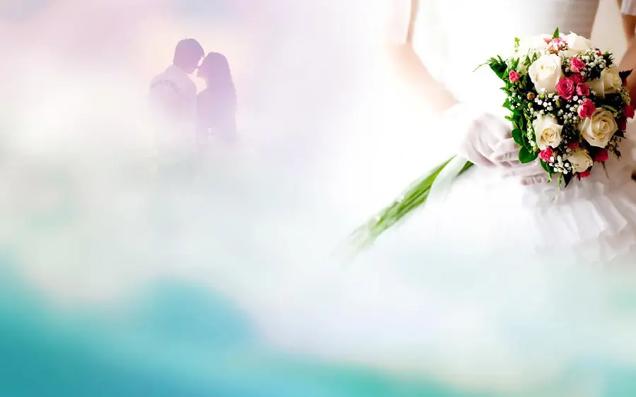 Blurred background of bride and groom with bouquet of small pink and large white flowers