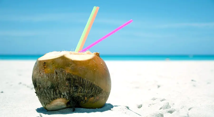 Interesting wallpaper of a cool coconut drink on a beautiful beach for your desktop