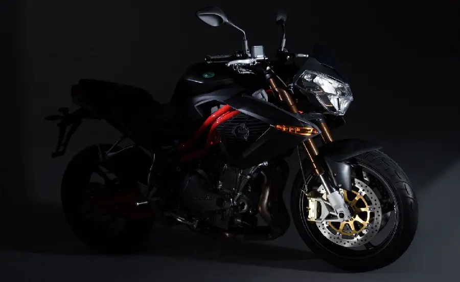 Half and half photo of a motorcycle with black power and a little red