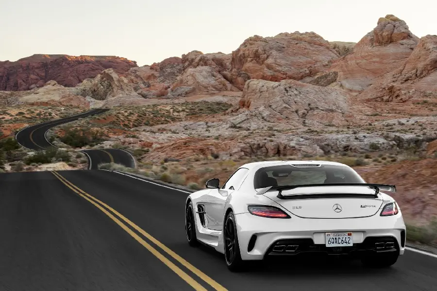Download a beautiful background image of a white Mercedes-Benz on the road
