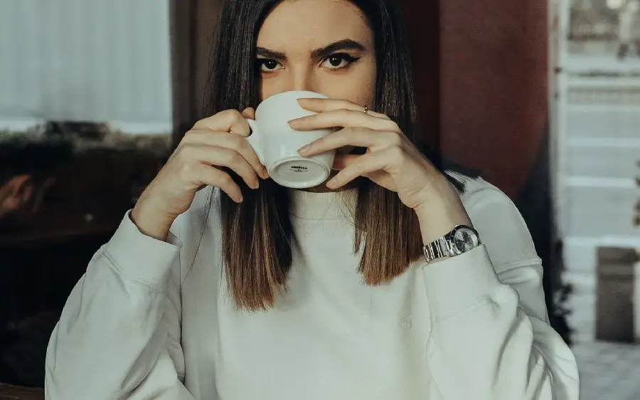 Beautiful profile picture of a girl drinking tea