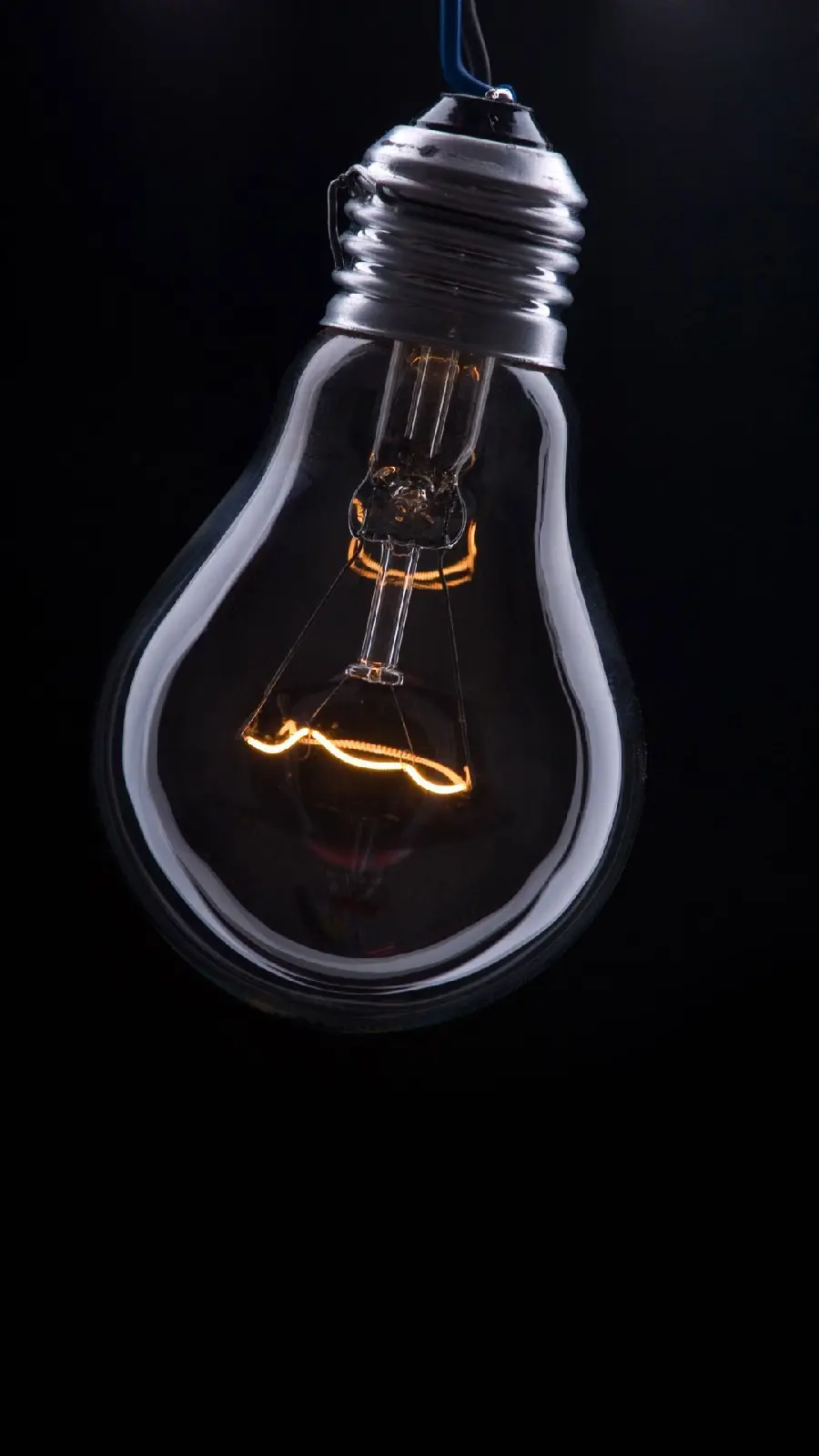 Exceptional Wallpaper of a Light Bulb on a Black Background for Windows 11