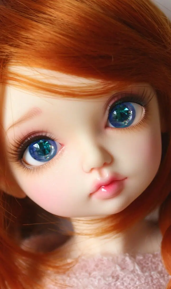 Cute Blue-Eyed Toy Doll Wallpaper