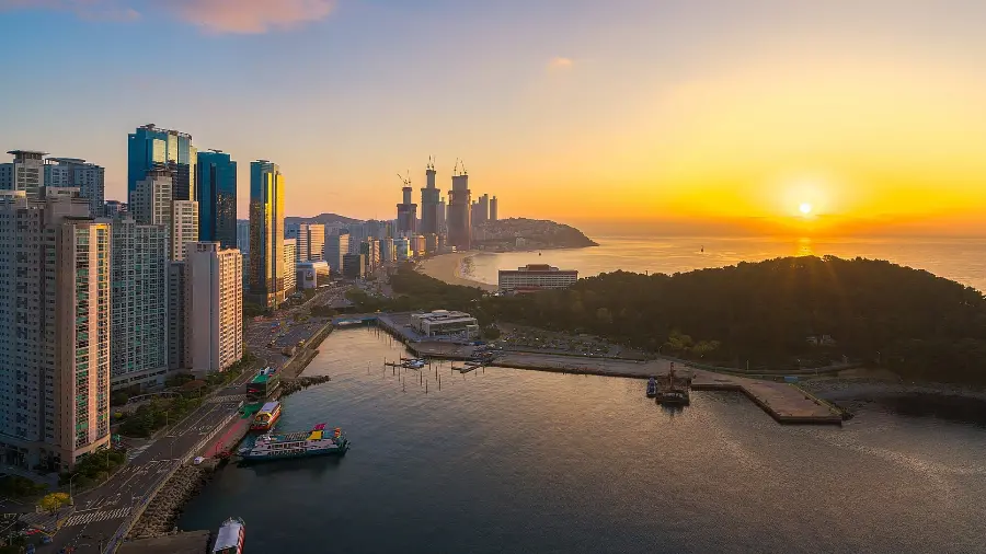 A stunning stock photo of a golden sunset next to countless beautiful new buildings and a diverse urban texture