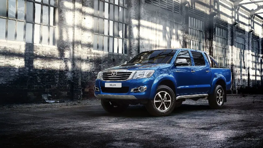 A beautiful blue Toyota Hilux HD background in a building with windows for WhatsApp