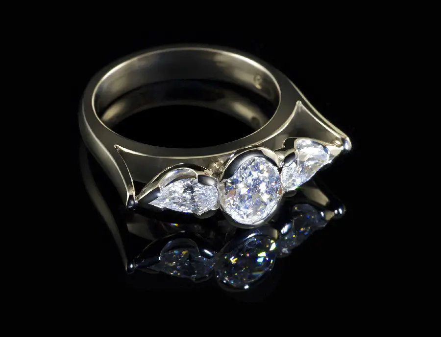 Download image of a precious white gold diamond ring on a black background