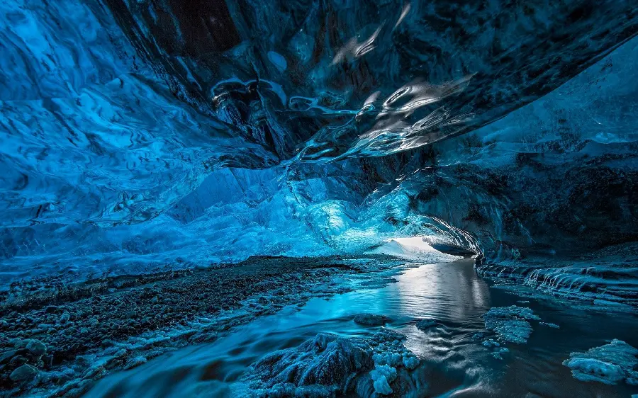 A spectacular ice cave with a dark and light blue theme with original quality for wallpaper and profile