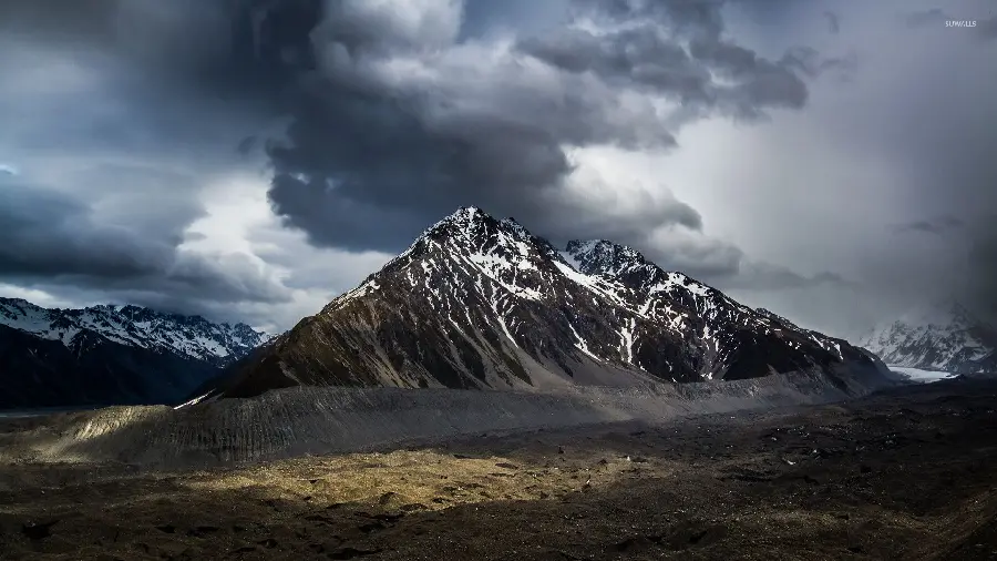 Magical wallpaper with a cloudy sky above the mountain in New Zealand