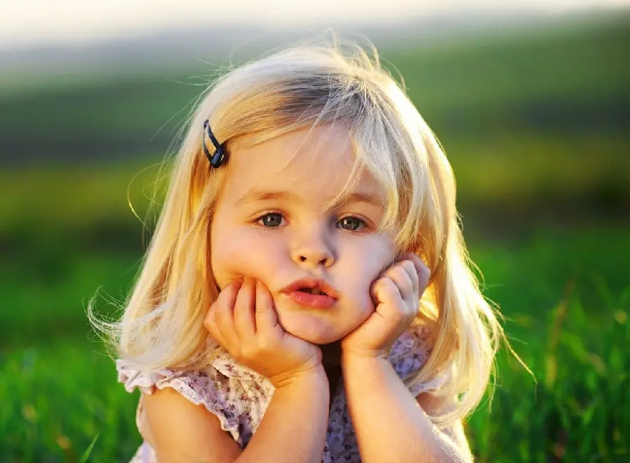 Download the image of a beautiful girl in lush nature for your desktop 