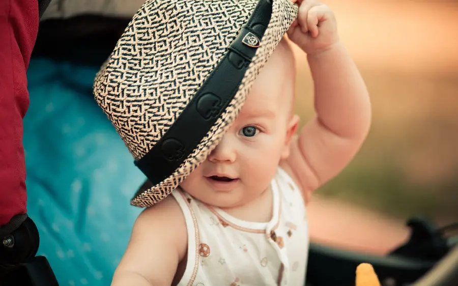 Cute stock photo of a handsome baby boy with a cool hat 
