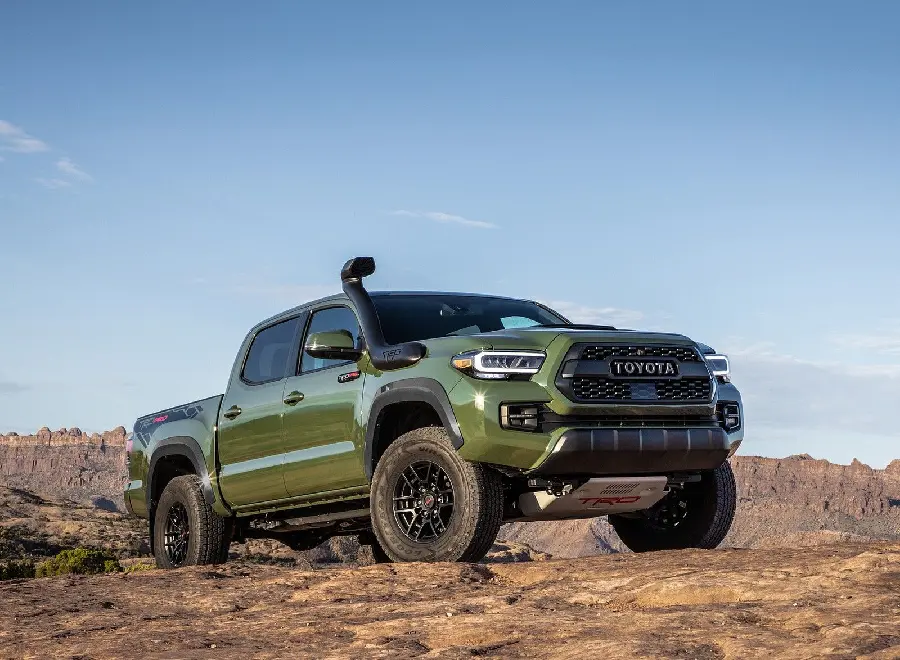 Download beautiful background of green Toyota Tacoma off-road in the mountains