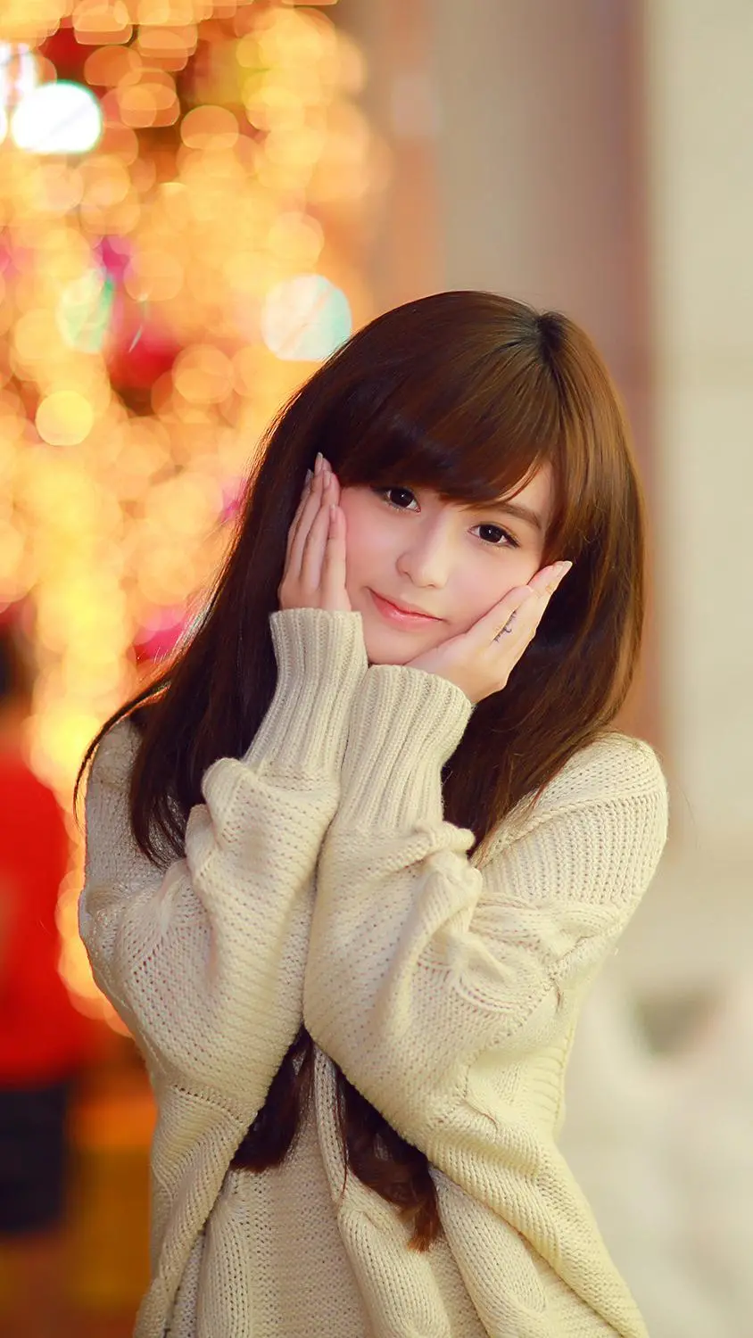 Attractive girly wallpaper of a Korean girl wearing a sweater