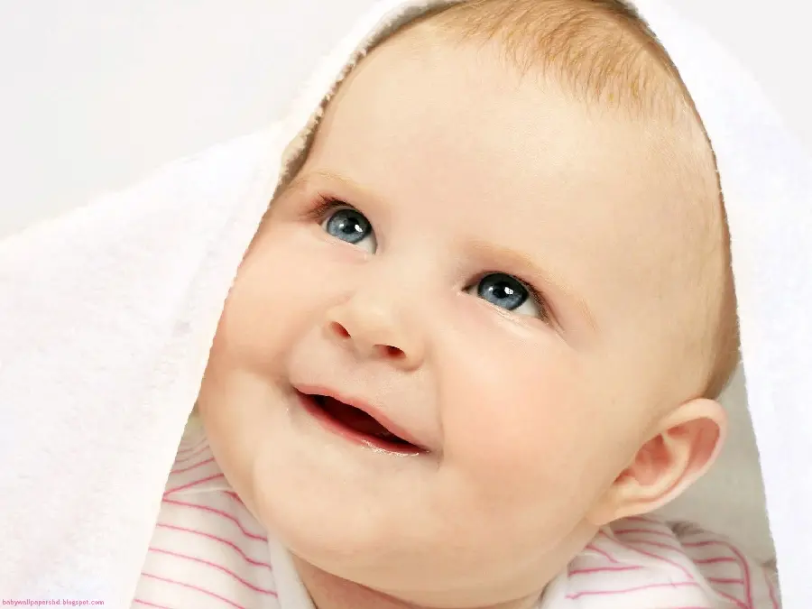 High quality and dreamy wallpaper of a charming smile of a beautiful baby boy