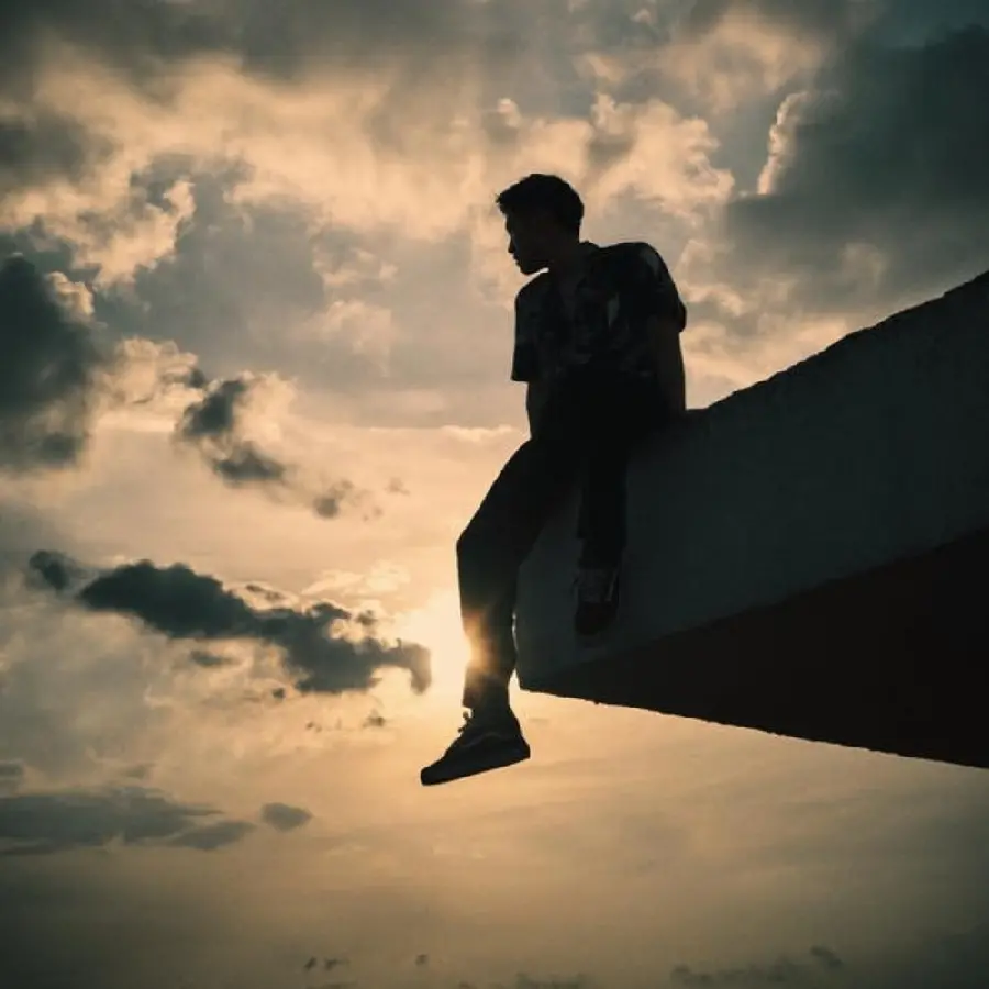 Profile photo of a lonely man in a cloudy sunset sky with special quality 