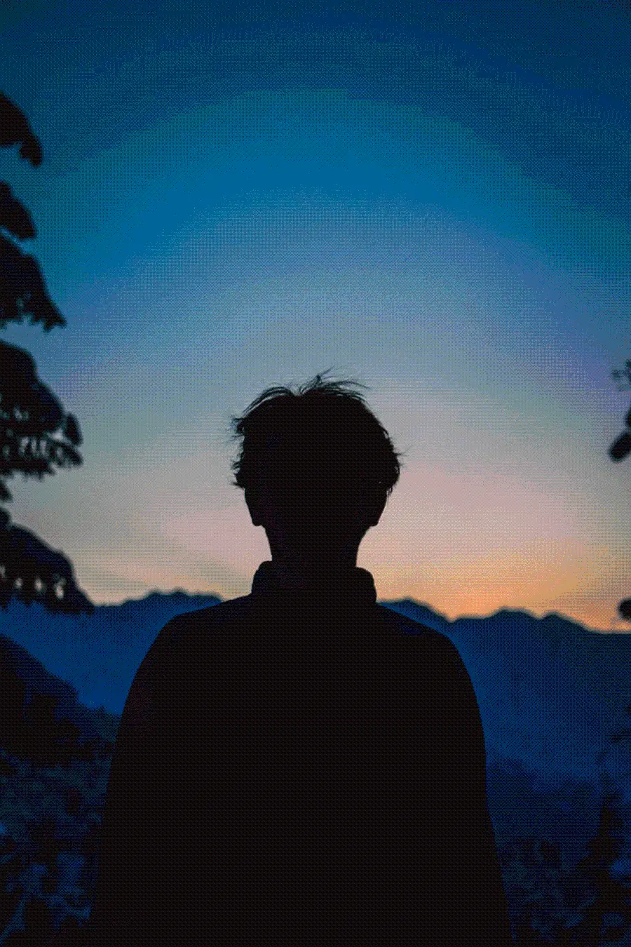 Magical background of boy Alone in the nature of the sunset for the phone 
