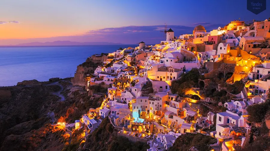 Splendid wallpaper of Santorini island lit up at night