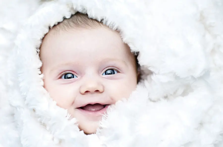 The cutest baby wallpaper with a beautiful smile of a baby girl for laptops