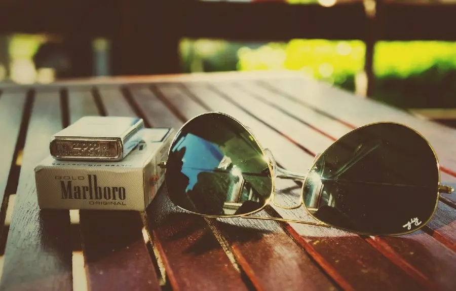 Marlboro cigarette with glasses and a gentleman's lighter