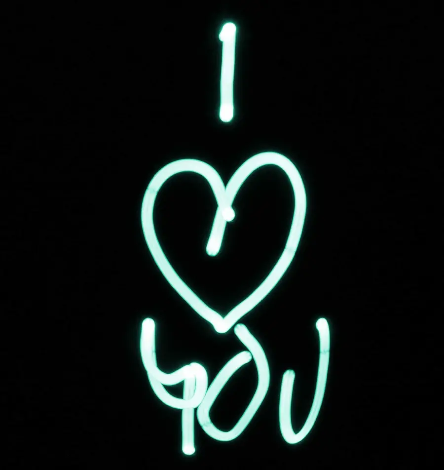 Romantic signature photo with a shiny fantasy font and a black background