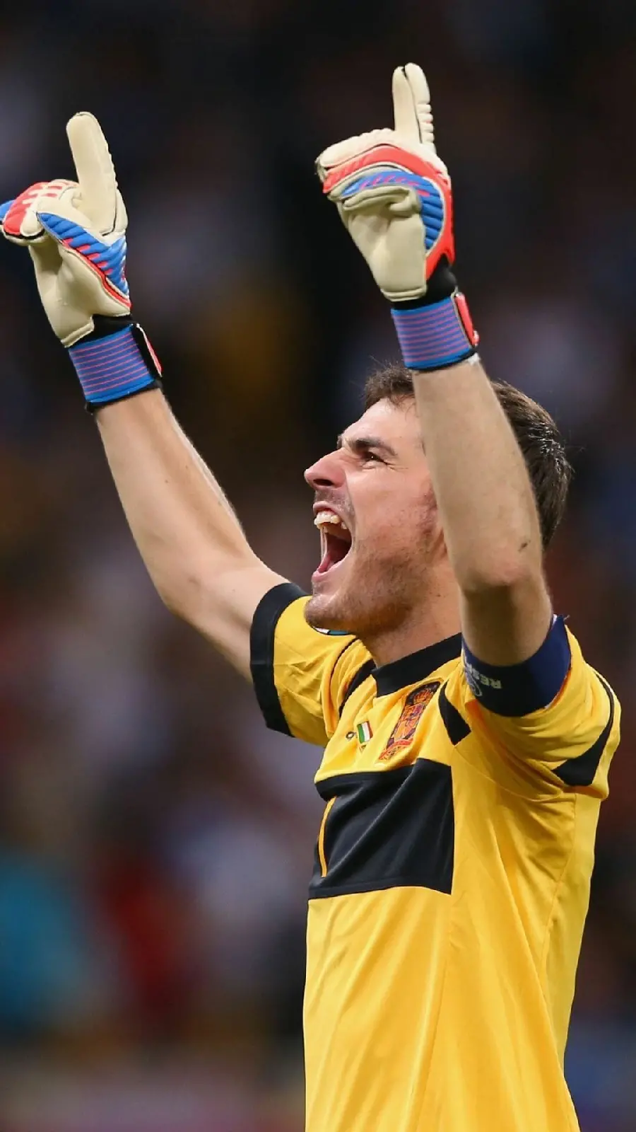 Attractive wallpaper of Casillas in a yellow shirt and happy
