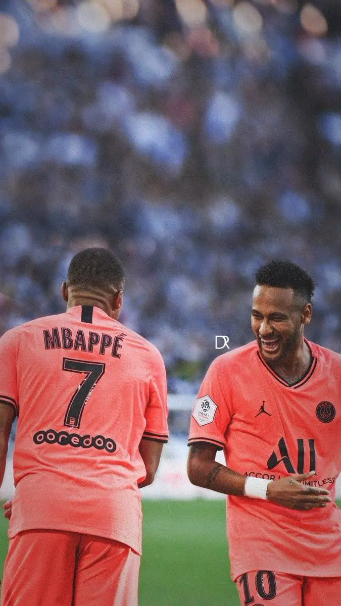 Top quality field of Neymar and Mbappe side by side and one standing forward and the other standing back