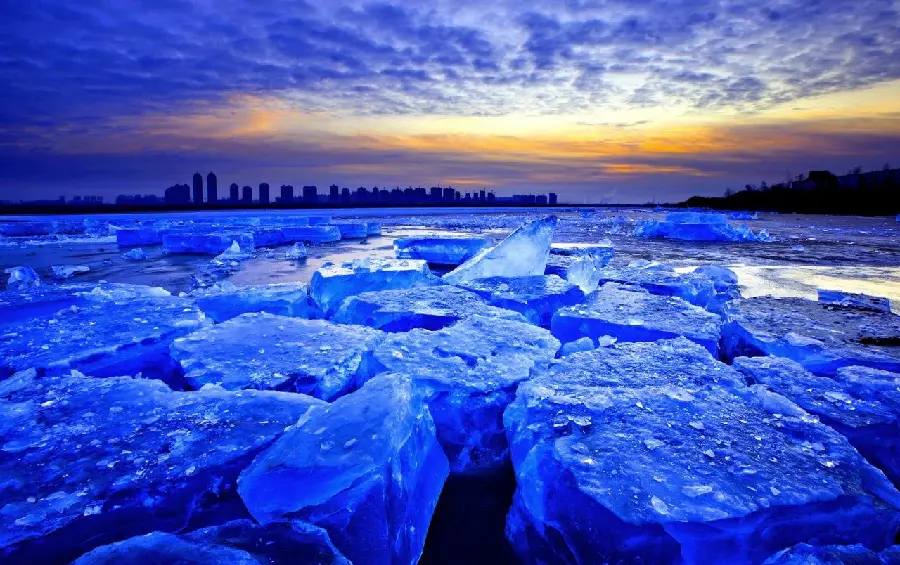 Download the magical wallpaper of small ice hills along the sunset in cold and winter weather with the most special quality
