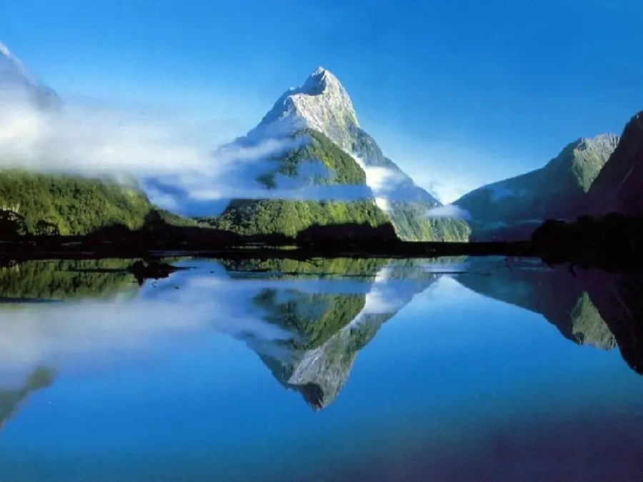 A pleasant view of the reflection of the image of mountains and trees in the water in excellent quality 