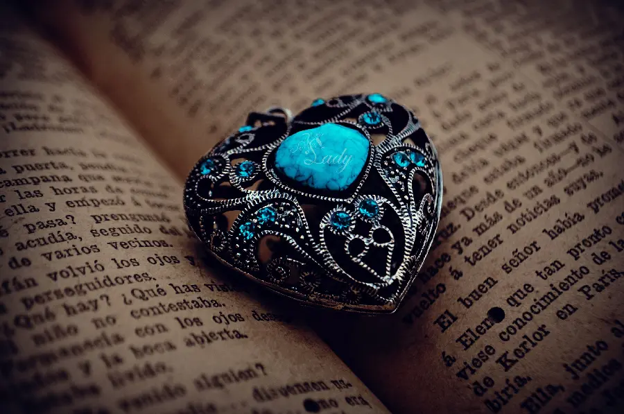 Magical and Sparkling Image of Antique Turquoise Jewelry in the Heart of Old Book Pages 