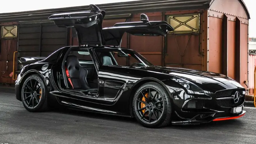 Popular stock photo of a black Mercedes-Benz next to a train carriage