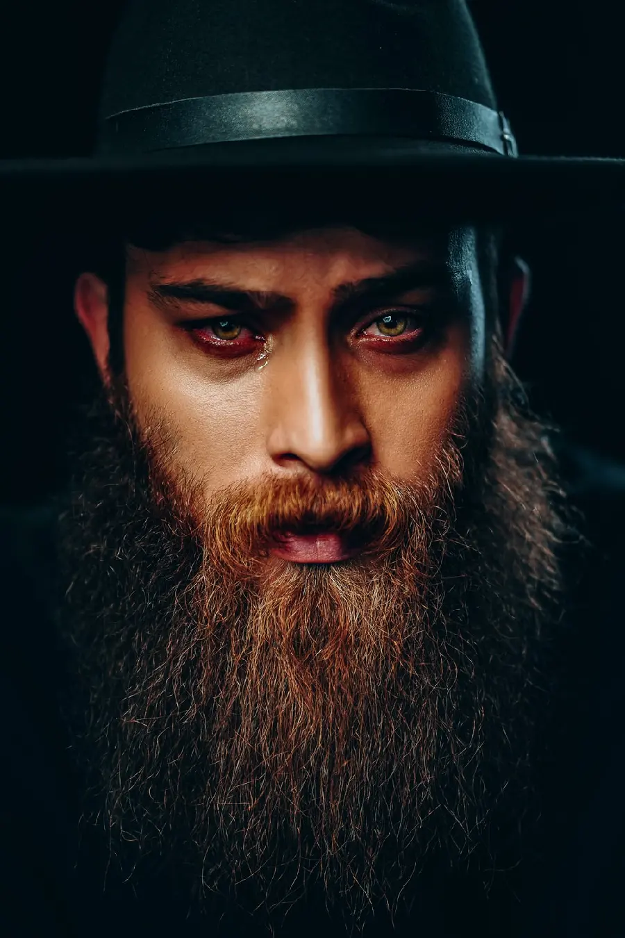 Download the image of a stylish beard model for a barbershop poster
