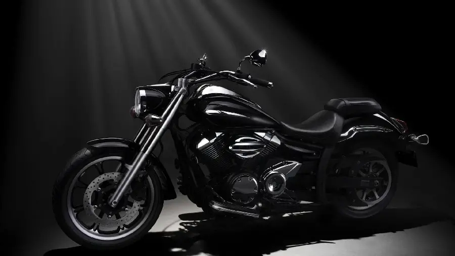 Download a demonstration image with rays of light from a large black sports motorcycle with high quality Top