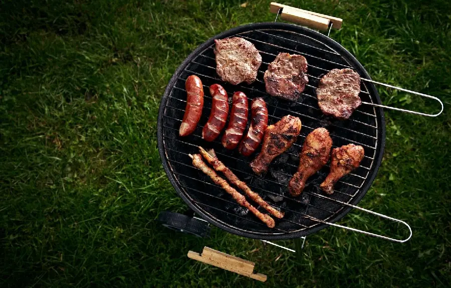 Amazing high quality background of chicken kebab, bacon, hot dogs on the grill in a cozy environment suitable for WhatsApp
