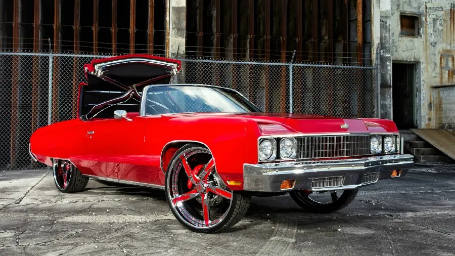 HD image of old red car with classic rims