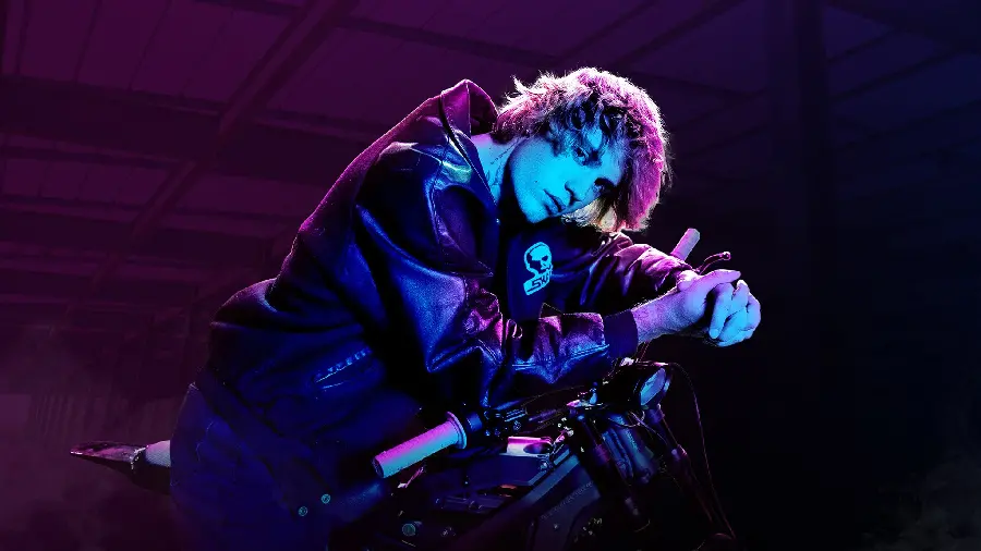 Magical photo of Justin Bieber with a motorcycle in a cool colored light 8K