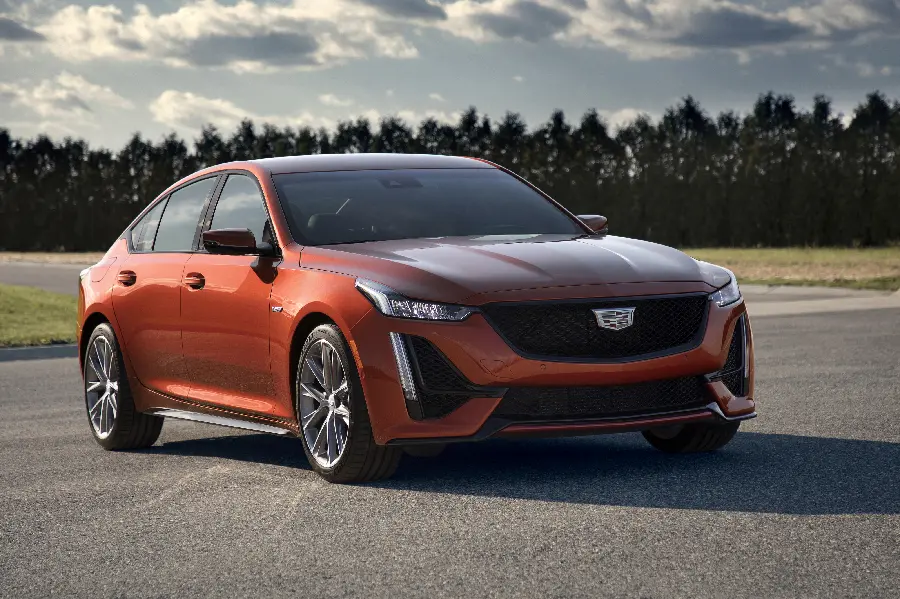 Special and exceptional background photo of a Cadillac car with orange color in HD quality