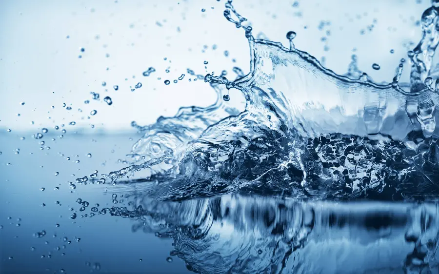 High quality blue background photo of sloppy waves and drinking water drops
