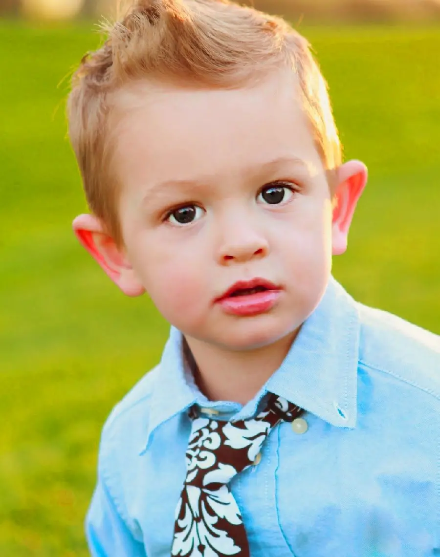 Artistic photo of a blond and handsome baby boy for Windows 11 background