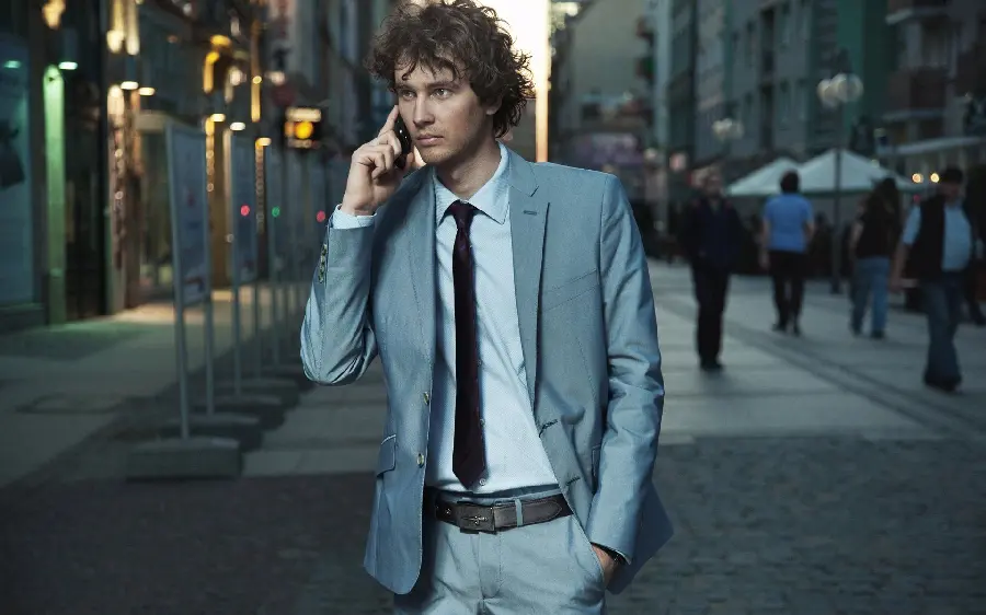 The most attractive stock photo of a man modeling in a suit on the street Populated city