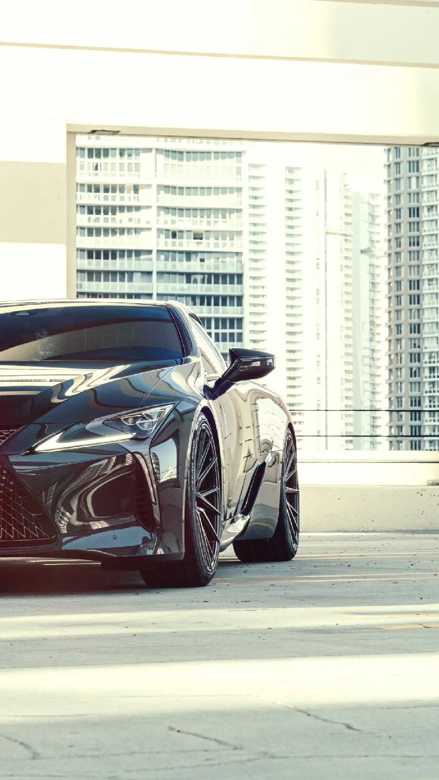 Classy poster of a black Lexus LC 500 next to a skyscraper